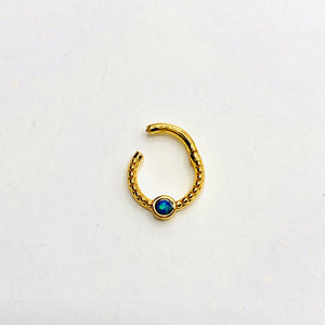 Gold opal septum clicker