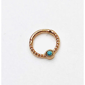 Gold septum with turqoise