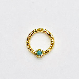 Gold septum with turqoise