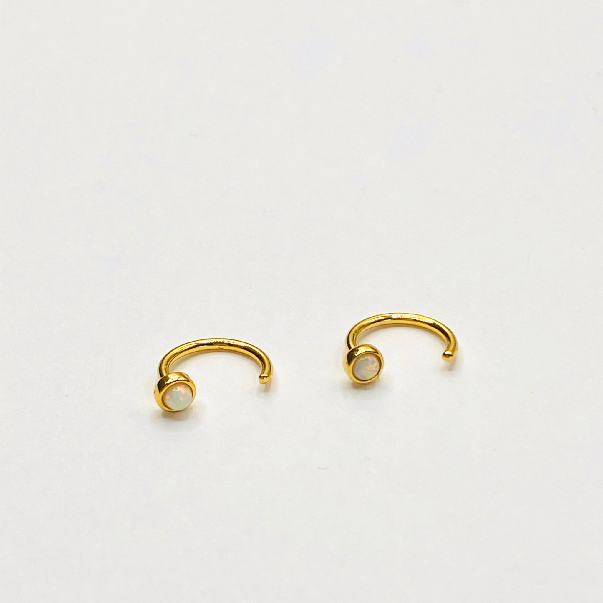 Opal huggie earring