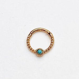Gold septum with turqoise