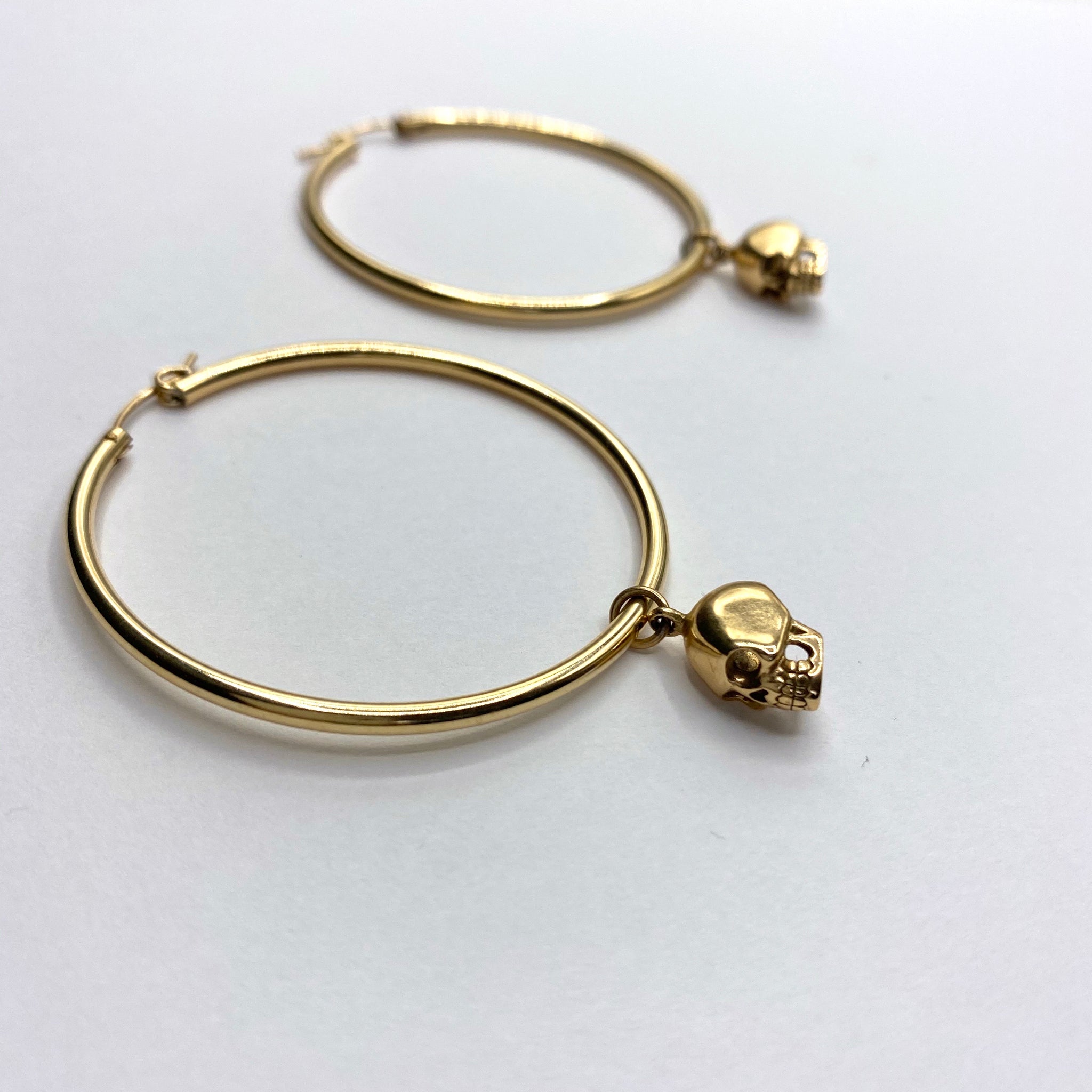 Large skull hoop earrings
