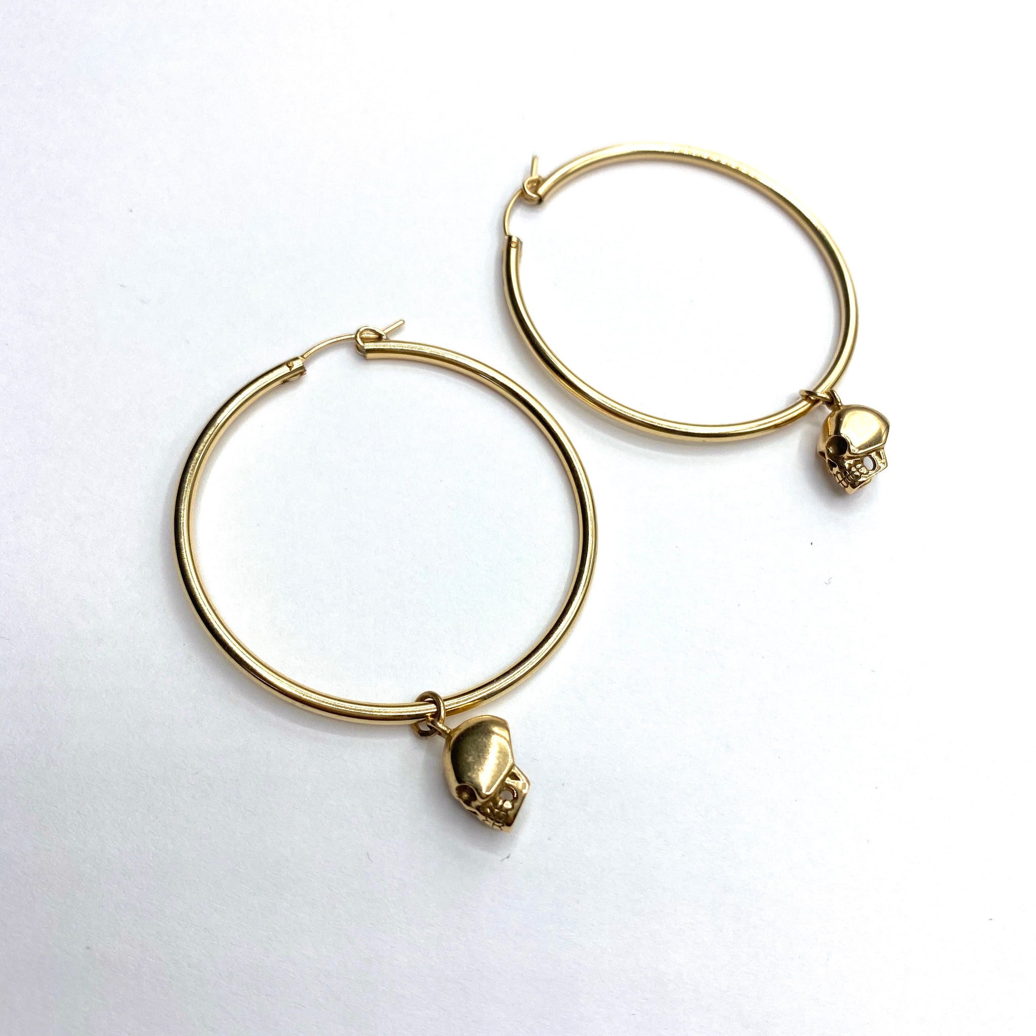 Large skull hoop earrings