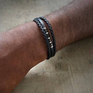 Black braided leather bracelet with stainless steel beads
